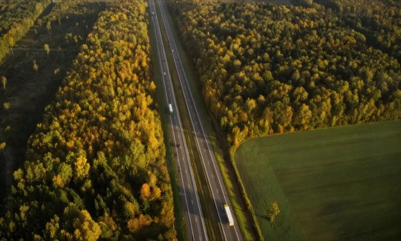 Highway corridor with acoustic barrier